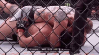 Man Laying In Cage With Number 30 On Arm GIF