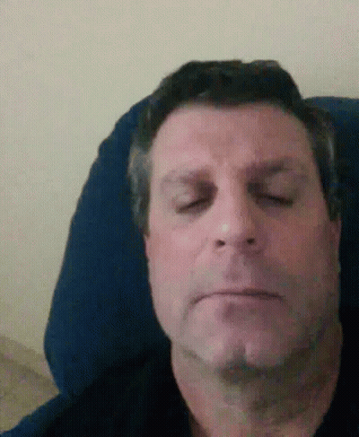Man Laying In Chair Eyes Closed GIF