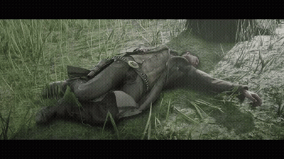 Man Laying In Grass With Gun GIF