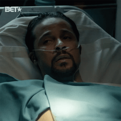 Man Laying In Hospital Bed With BET Logo GIF