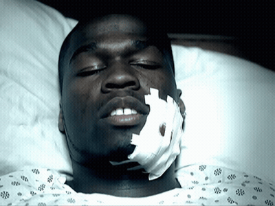 Man Laying In Hospital Bed With Face Bandage GIF