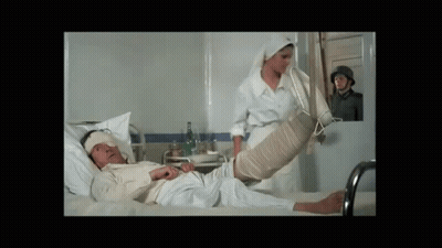 Man Laying In Hospital Bed With Leg Bandage GIF