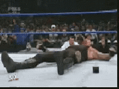 Man Laying In Wrestling Ring With Fox Logo GIF