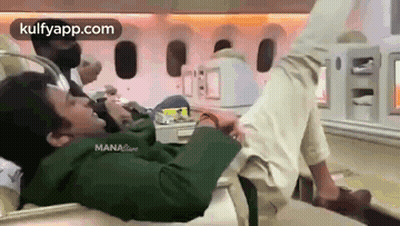 Man Laying On Airplane Floor GIF