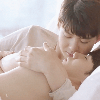 Man Laying On Another Man's Chest With Letter P GIF