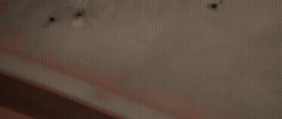 Man Laying On Back In Dark Room Eyes Closed GIF
