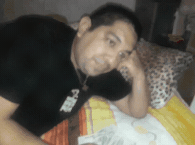 Man Laying On Bed In A Shirt GIF