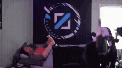 Man Laying On Bed In Front Of Wall With Z Logo GIF