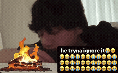 Man Laying On Bed Next To Fire Trying To Ignore It GIF