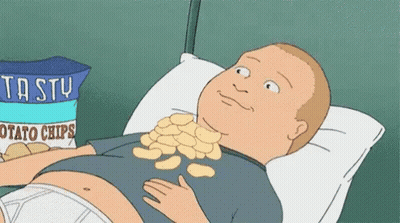 Man Laying On Bed With Bag Of Potato Chips GIF