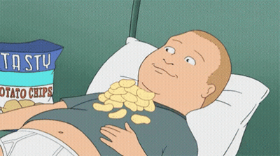 Man Laying On Bed With Bag Of Potato Chips GIF