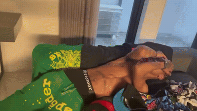 Man Laying On Bed With Green Blanket Saying Brasil GIF