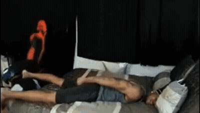 Man Laying On Bed With Legs Crossed GIF