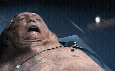 Man Laying On Bed With Mouth Open GIF