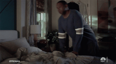Man Laying On Bed With NBC Logo GIF