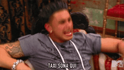 Man Laying On Couch Arms Outstretched Says Taxi Sona Qui GIF