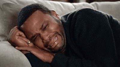 Man Laying On Couch Crying Eyes Closed GIF