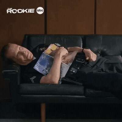 Man Laying On Couch Holding Magazine Saying That Was Beautiful GIF