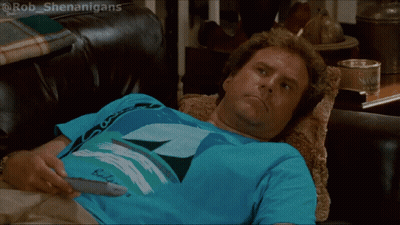 Man Laying On Couch Holding Remote In Budweiser Shirt GIF