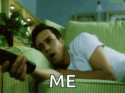 Man Laying On Couch Holding Remote Saying Me GIF