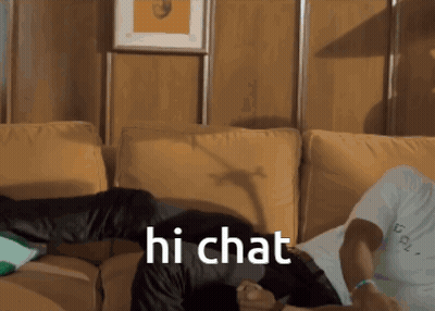 Man Laying On Couch Saying Hi Chat GIF