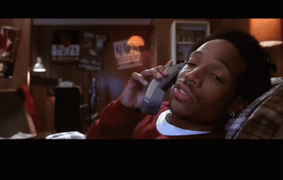 Man Laying On Couch Talking On Cell Phone Saying Cierto GIF