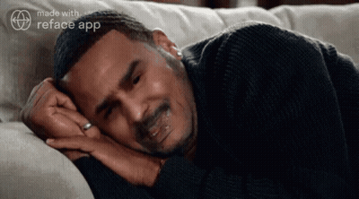 Man Laying On Couch With Eyes Closed And Reface App Logo GIF