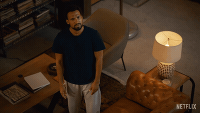 Man Laying On Couch With Netflix Logo GIF