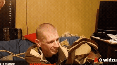 Man Laying On Couch With Suchodolski Sign GIF