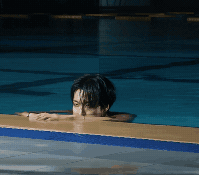 Man Laying On Edge Of Pool GIF
