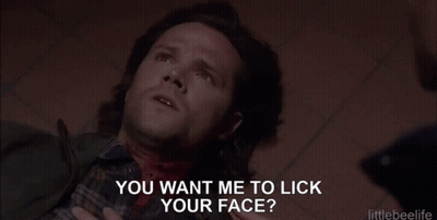 Man Laying On Floor With Blood Coming Out Of Neck While Another Man Holds His Hand Around His Neck GIF