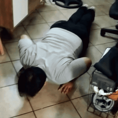 Man Laying On Floor With Head On Knees GIF