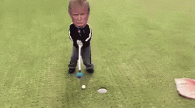 Man Laying On Golf Course With Flag And Club GIF