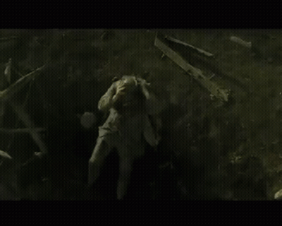 Man Laying On Ground In Dark Area GIF