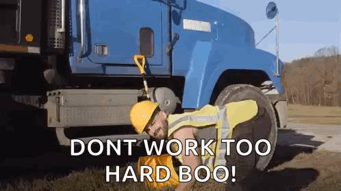 Man Laying On Ground Next To Blue Truck With Dont Work Too Hard Boo GIF