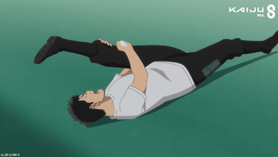 Man Laying On Ground With Kaiju Text GIF