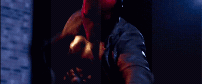 Man Laying On Ground With Knife GIF