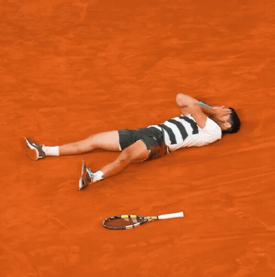Man Laying On Ground With Tennis Racquet GIF