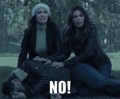 Man Laying On Ground With Two Women Screaming No GIF