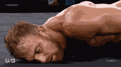 Man Laying On Ground With WWE NXT Logo GIF