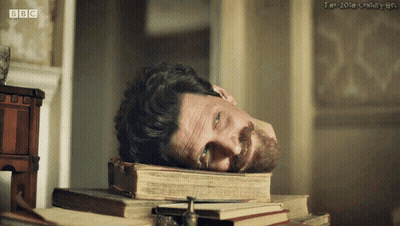 Man Laying On Pile Of Books BBC GIF