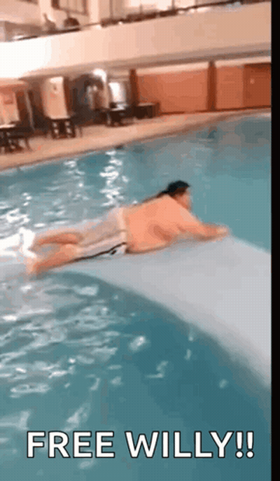 Man Laying On Raft In Pool Free Willy! GIF