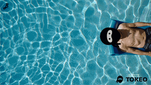 Man Laying On Raft In Pool With Tokeo Logo GIF