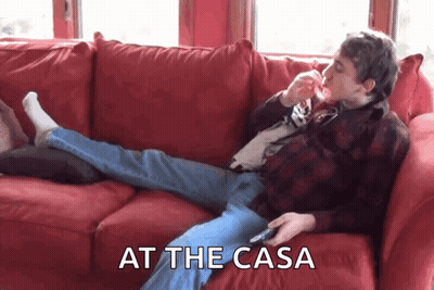 Man Laying On Red Couch At The Casa GIF