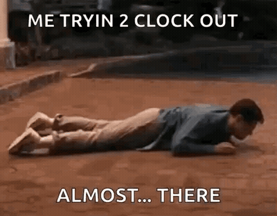 Man Laying On Stomach With Clock Behind GIF