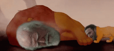 Man Laying On Table Next To Large Orange Object GIF