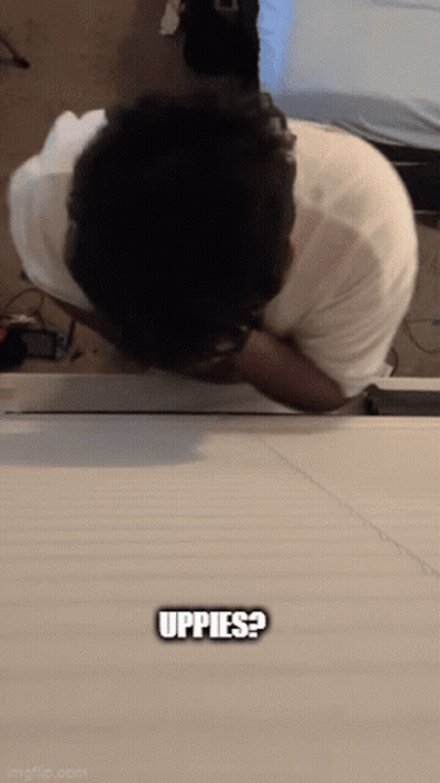 Man Laying On Table Saying Uppes GIF
