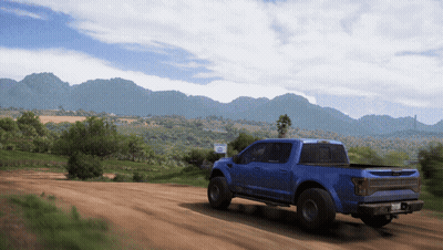 Man Laying On Truck Hood In Woods GIF