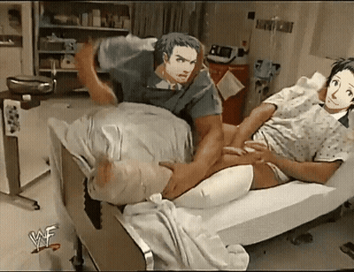 Man Laying On Woman's Lap In WWE Hospital Bed GIF