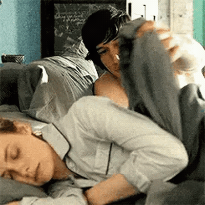 Man Laying On Woman's Lap On Couch GIF